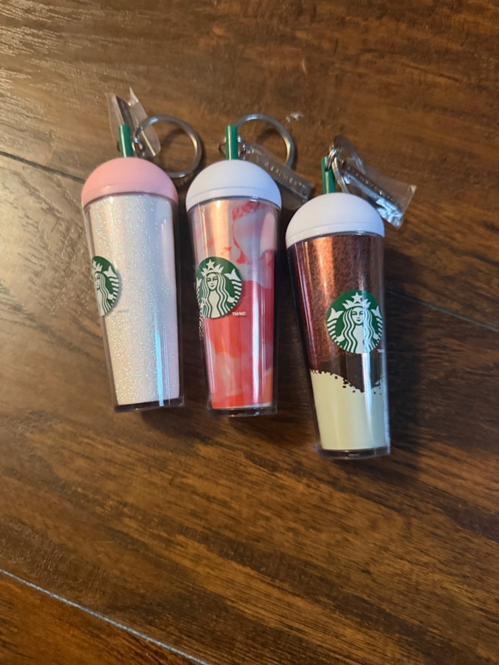Three Starbucks keychains